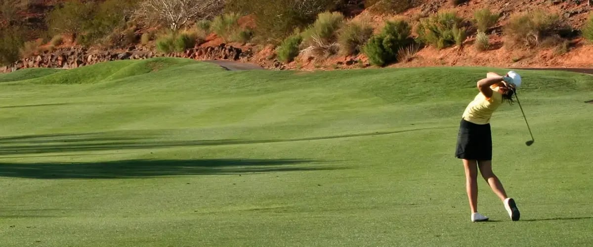 Golfer swinging on an Arizona course; experience optimal joint health with Desert Spine and Sports Physicians.