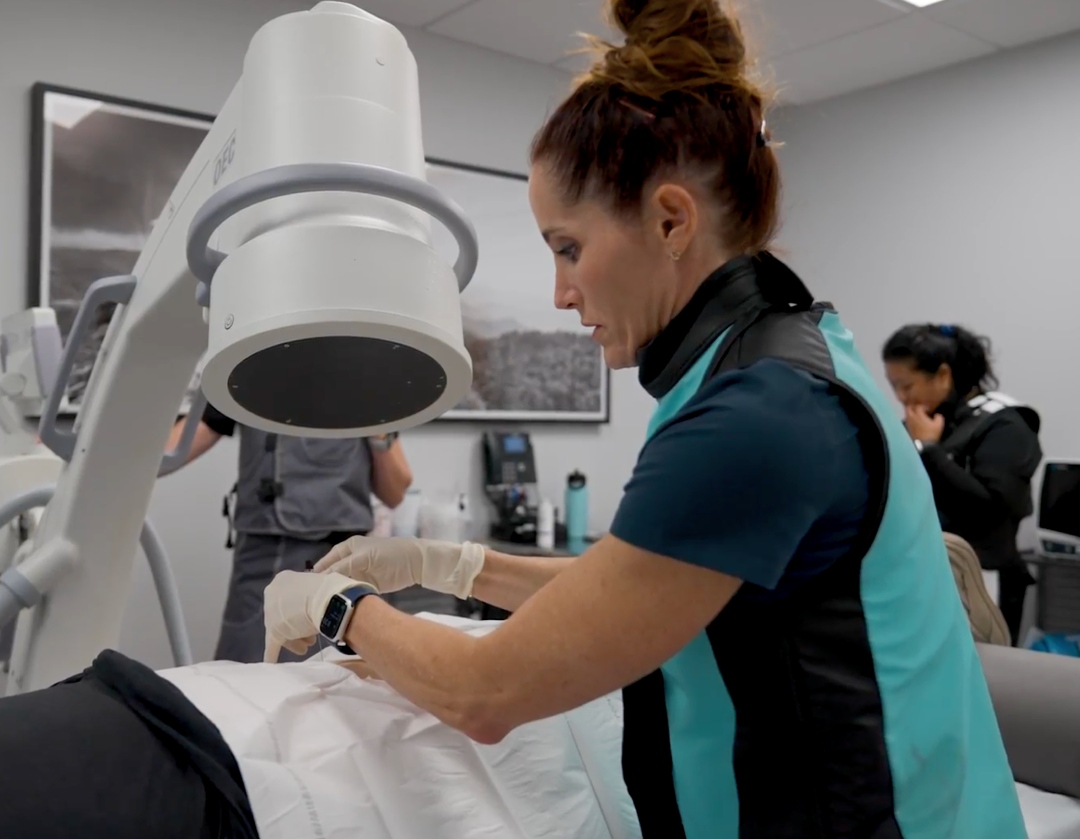 Healthcare professional administering advanced spine treatment at Desert Spine and Sports Physicians, Arizona.