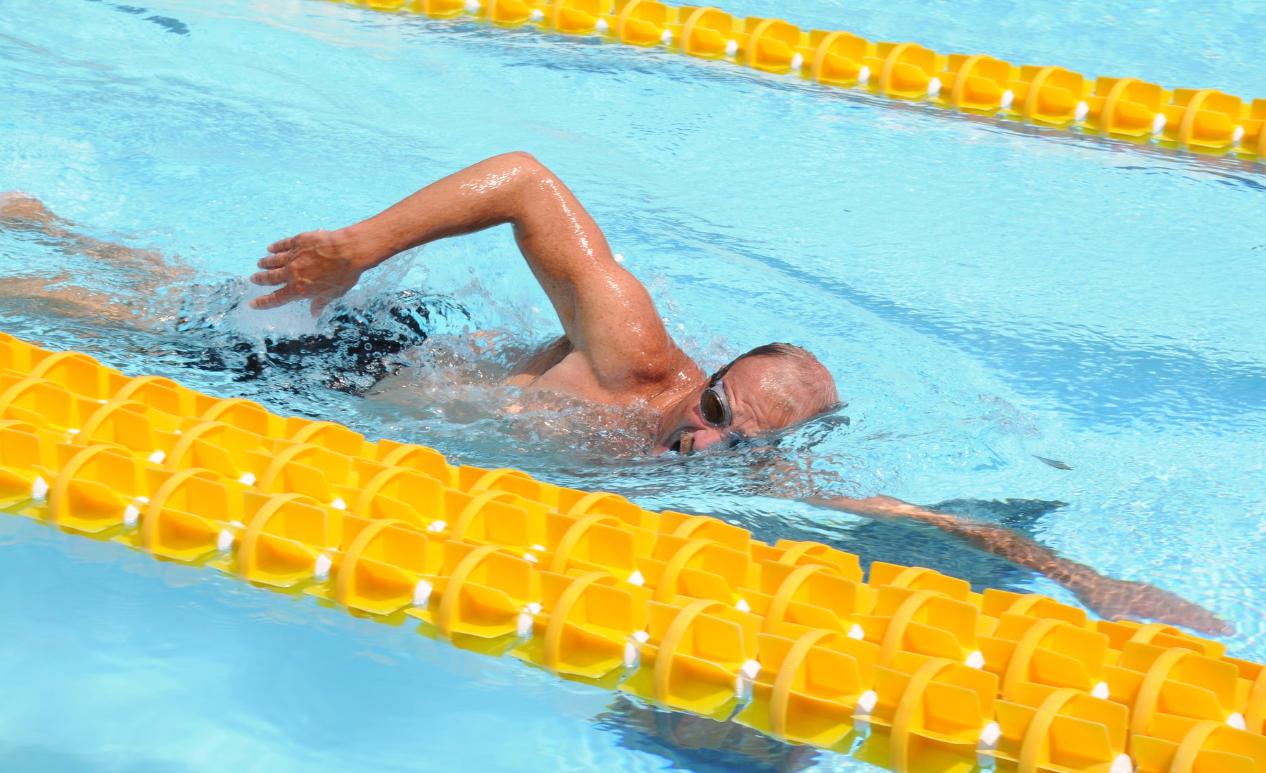 aquatic therapy, spine - person swimming in a lane