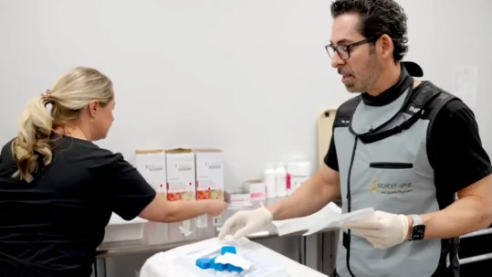 DSSP professionals prepare for a spine procedure, ensuring precision and patient safety in a sterile environment.